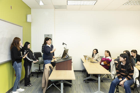 Seihoon Lee and his group present their research in the Diplomacy Lab course. Photo bib Ron Aira/Office of University Branding.